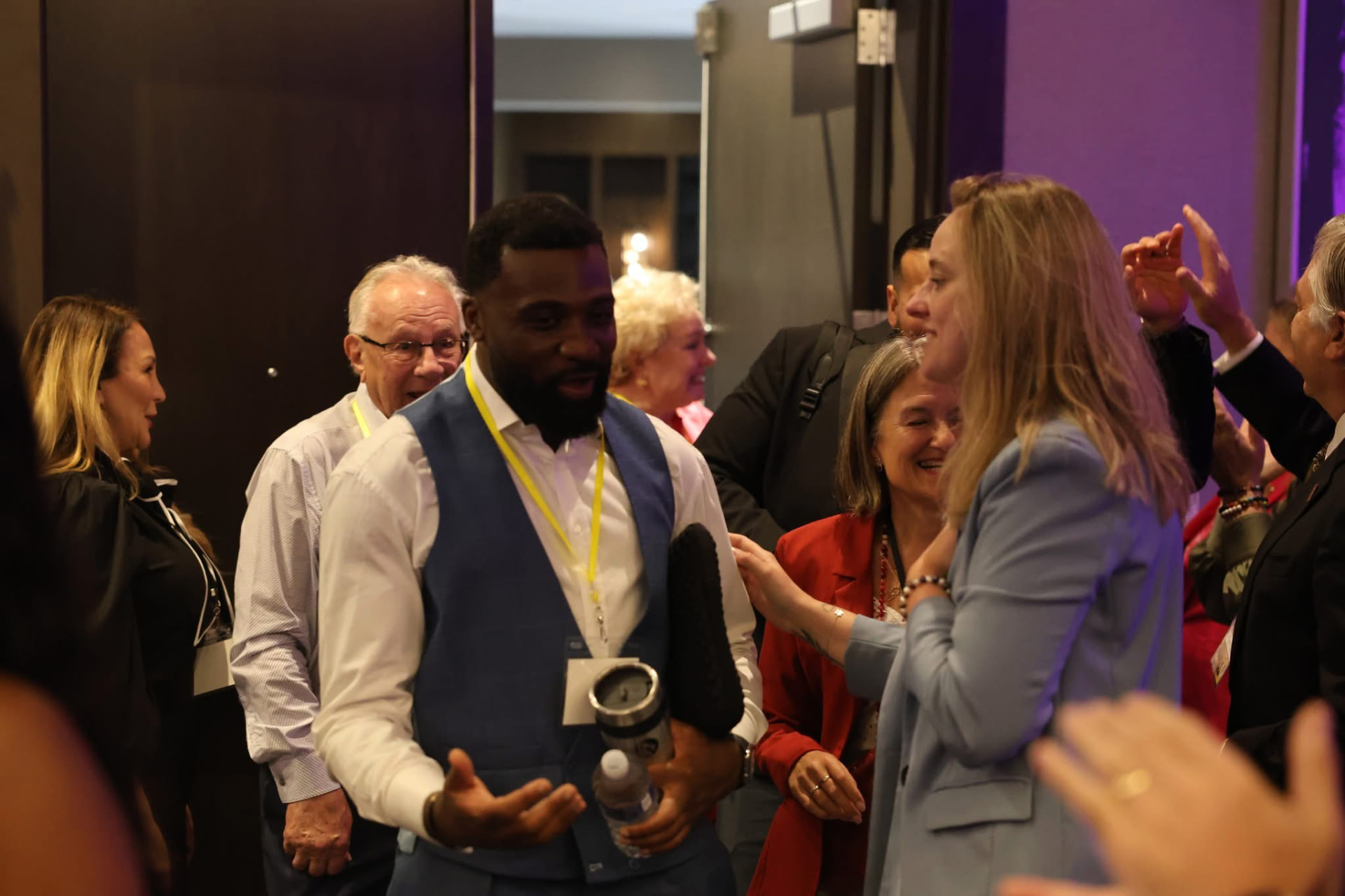 Delegates greeting each other between sessions at a Napoleon Hill Institute event